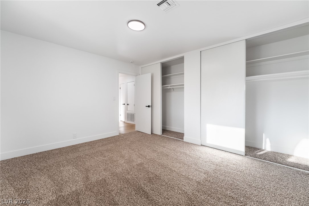 429 Crestway Road Henderson, NV 89015 - Photo 35 of 56 Well-lit sleeping quarters with fresh carpet and convenient closet space.