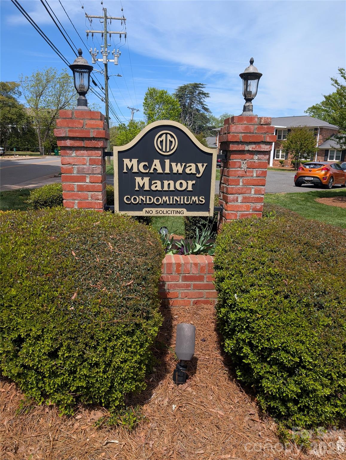 a sign board with a small yard