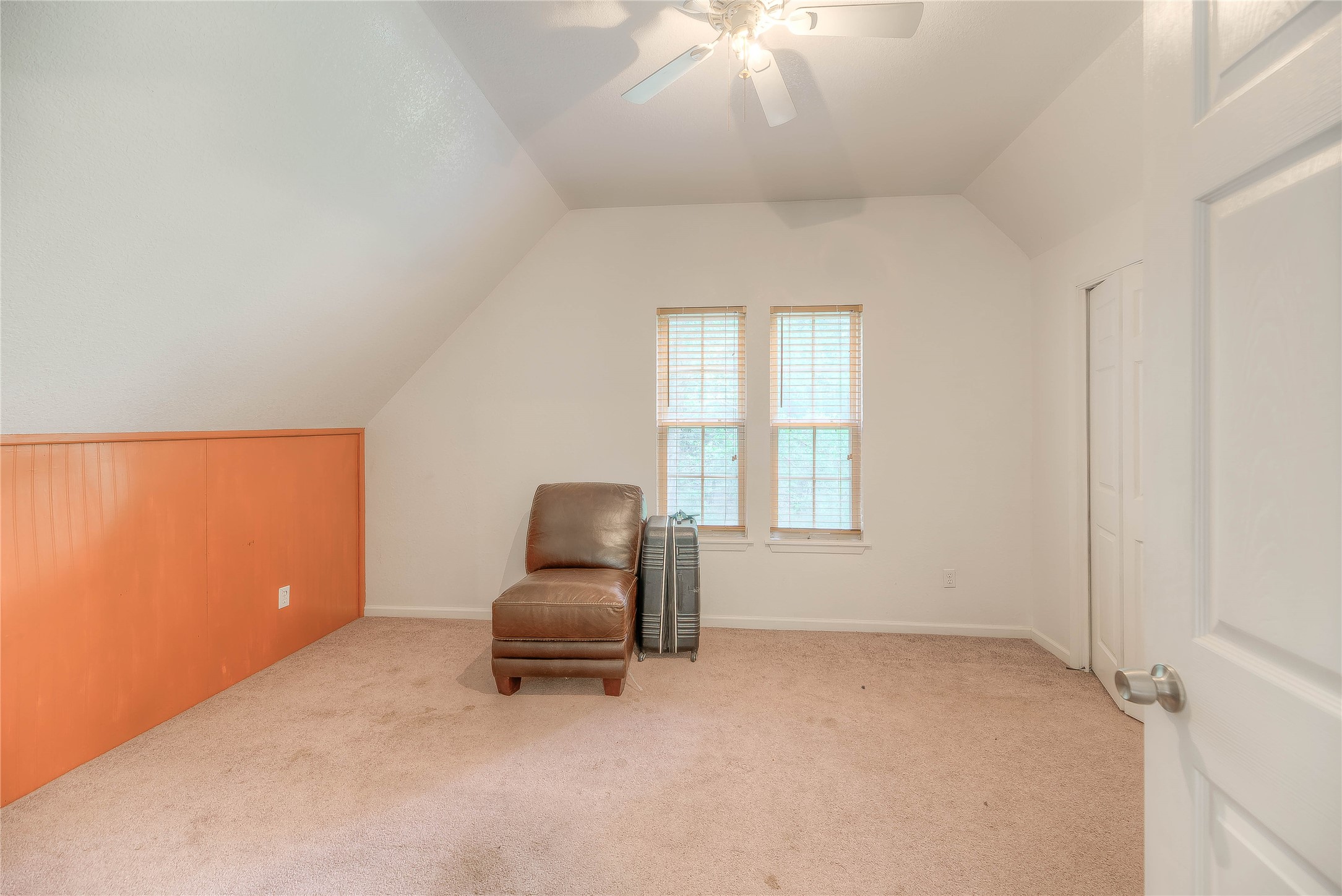 110 Happy Trails Road Coldspring, TX 77331 - Photo 27 of 49 an empty room with windows and ceiling fan