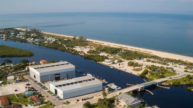 an aerial view of a house with a swimming pool