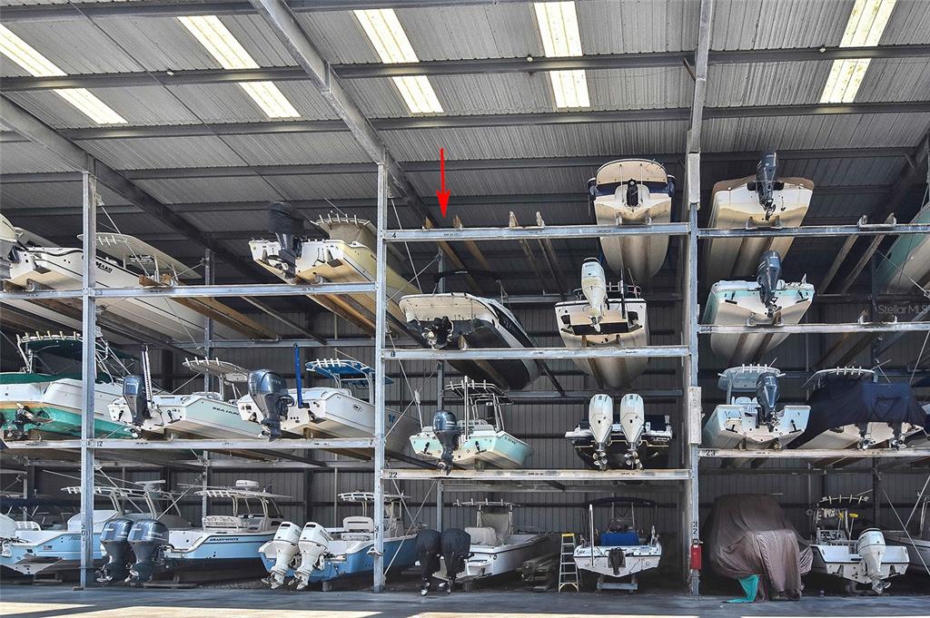 100 Circuit Road, Unit N80 Nokomis, FL 34275 - Photo 2 of 14 a view of store room with wooden racks