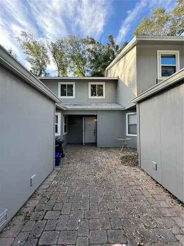 a view of a house with a backyard