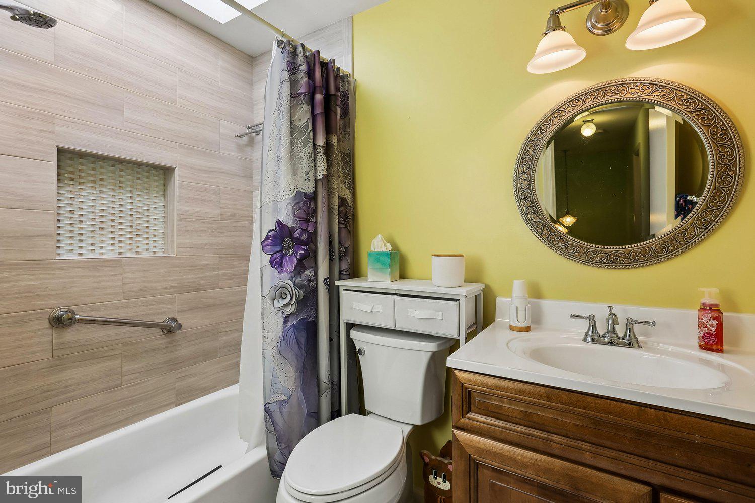 14822 Rose Trellis Place Silver Spring, MD 20906 - Photo 38 of 65 a bathroom with a sink a toilet and shower