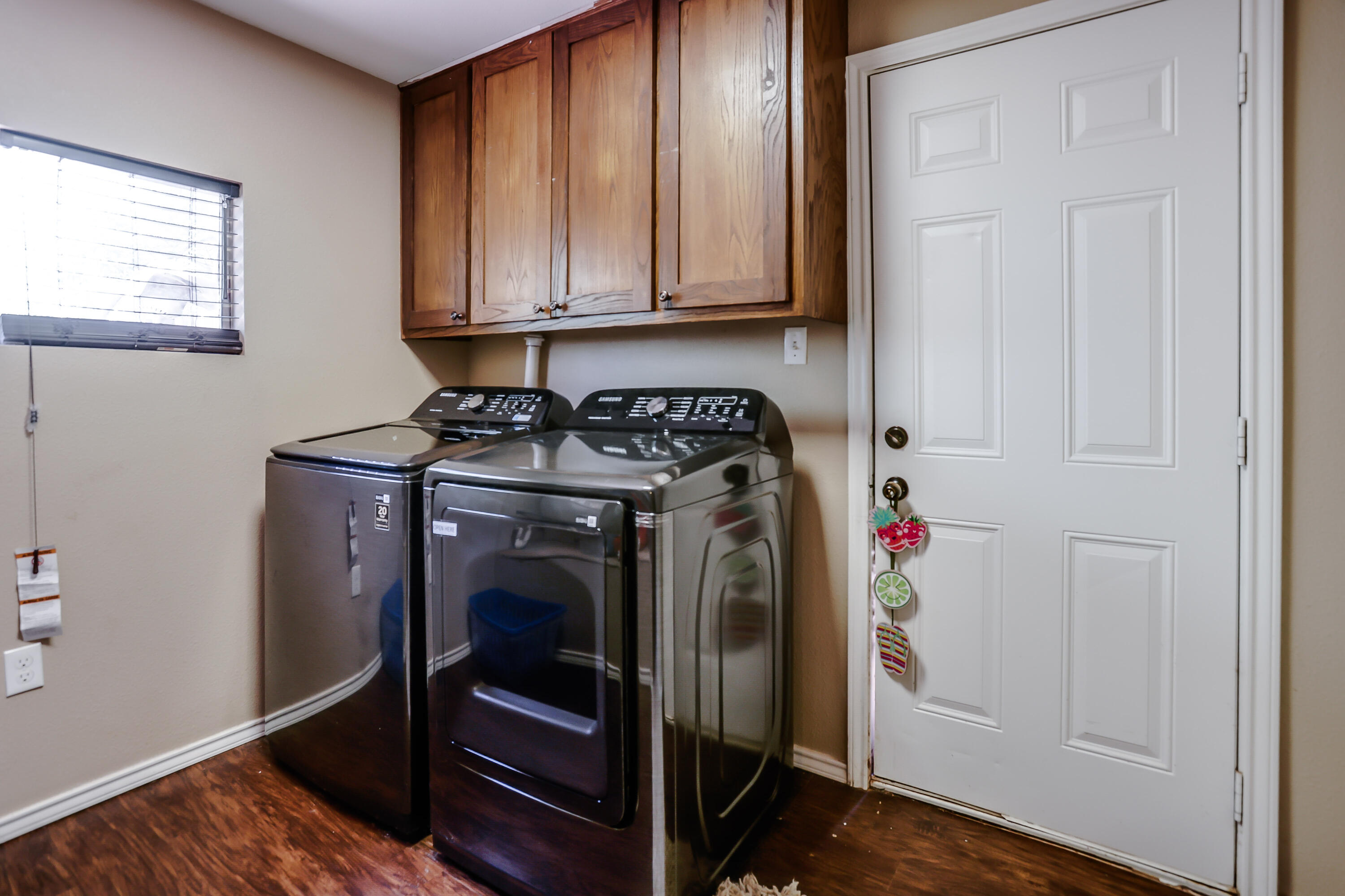 68 Pony Express Trail Lubbock, TX 79404 - Photo 15 of 15 a utility room with dryer and washer