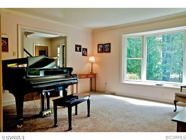 10800 Shingle Oak Road Chester, VA 23831 - Photo 2 of 11 a living room with furniture and a piano