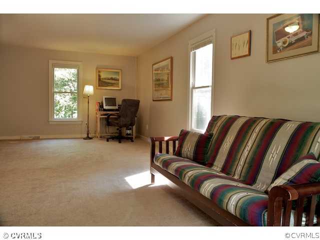 10800 Shingle Oak Road Chester, VA 23831 - Photo 7 of 11 a living room with furniture and a window