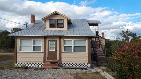 a front view of a house with a garage