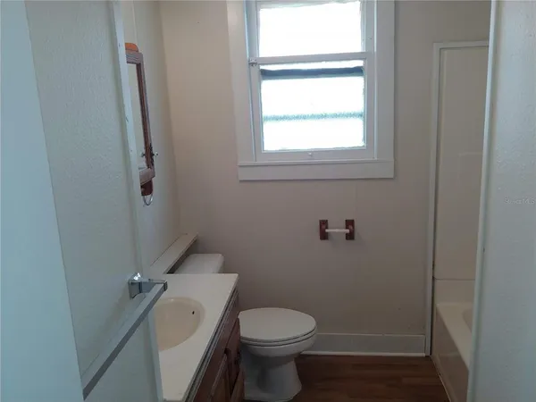 a bathroom with a toilet and a sink