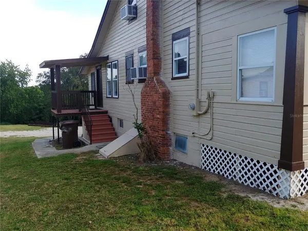 a front view of house with a garden