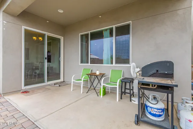 a dining room with furniture and a window