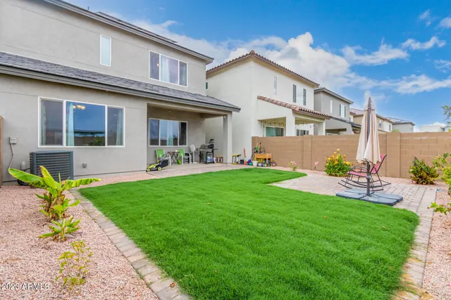 a front view of a house with garden and porch