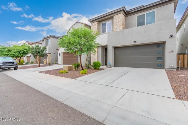 a house with palm tree in front of it