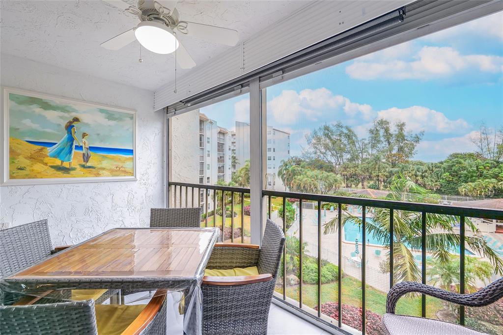 a view of a balcony with furniture