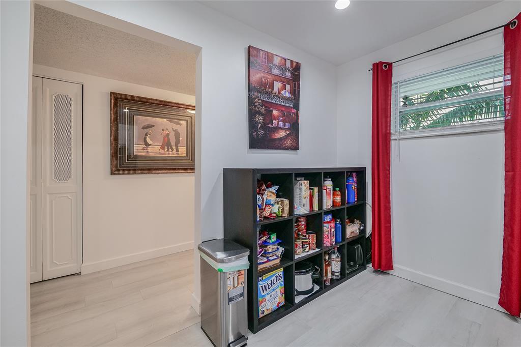 3930 Inverrary Boulevard, Unit 407D Lauderhill, FL 33319 - Photo 11 of 60 a room with lots of books