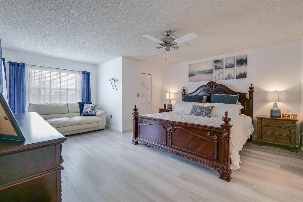 3930 Inverrary Boulevard, Unit 407D Lauderhill, FL 33319 - Photo 13 of 60 a living room with furniture and a couch