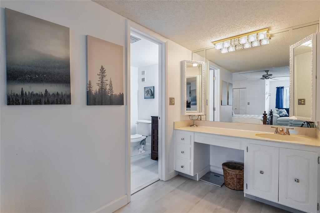 3930 Inverrary Boulevard, Unit 407D Lauderhill, FL 33319 - Photo 19 of 60 a spacious bathroom with a double vanity sink toilet and shower