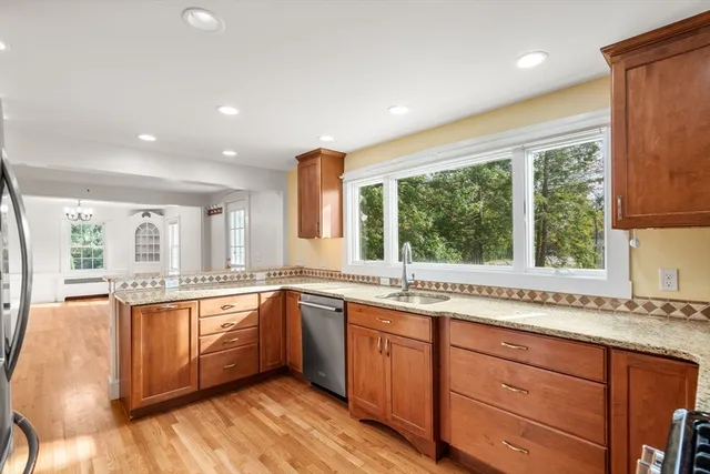 a kitchen with a sink stove and cabinets