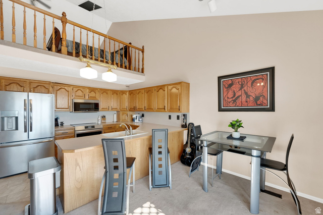5057 South Ridgedale Drive Ogden, UT 84403 - Photo 25 of 69 Kitchen with light wood cabinetry, stainless steel appliances, and a double basin sink