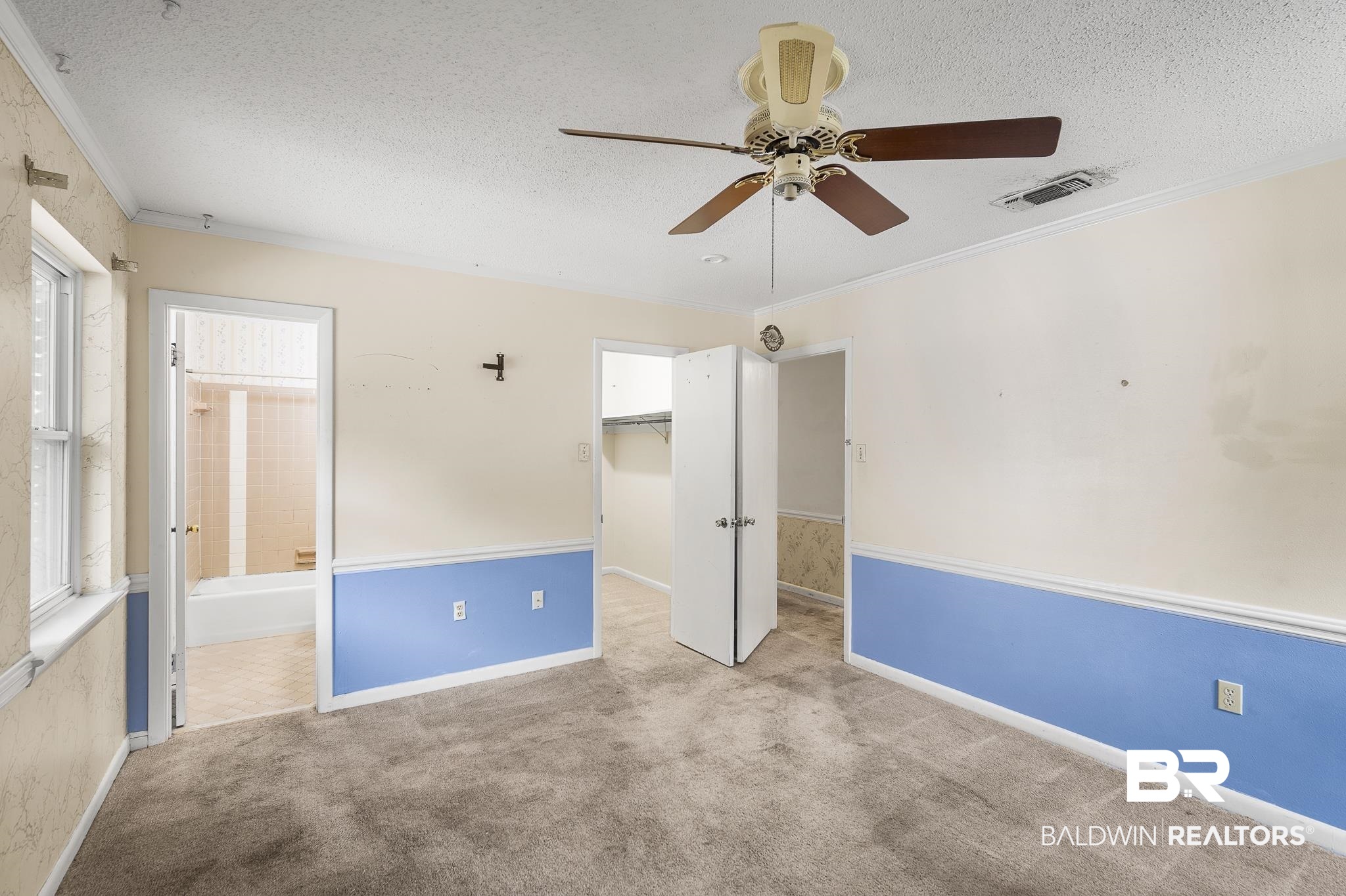2710 Longleaf Drive Mobile, AL 36693 - Photo 9 of 27 Unfurnished bedroom with light carpet, ensuite bath, ceiling fan, and a textured ceiling
