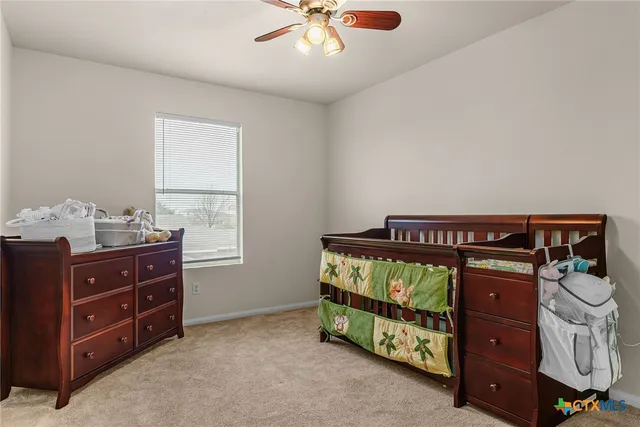 a bed room with a bed and a window