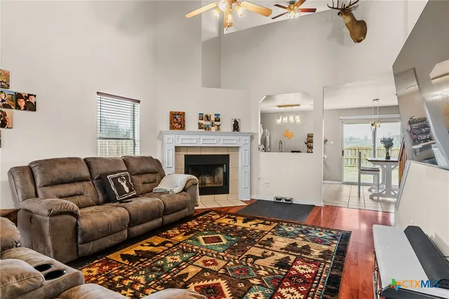 a living room with furniture and a fireplace