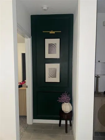 a bathroom with a toilet and a mirror