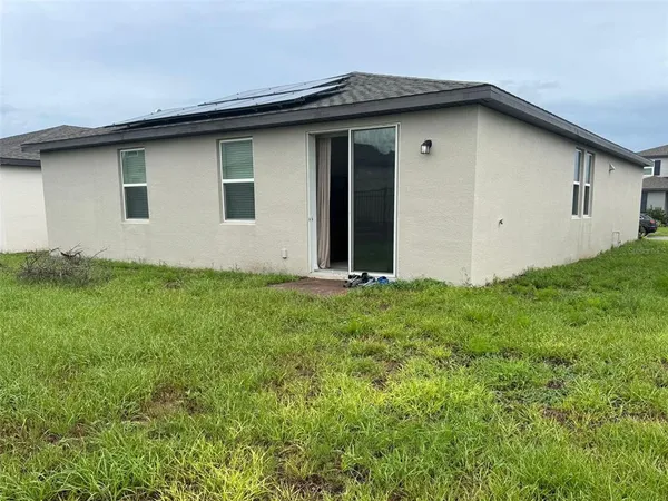 a house with garden in front of it