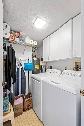 a view of storage and utility room with washer and dryer