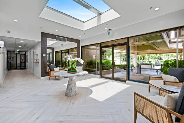 a building outdoor space with patio furniture and potted plants