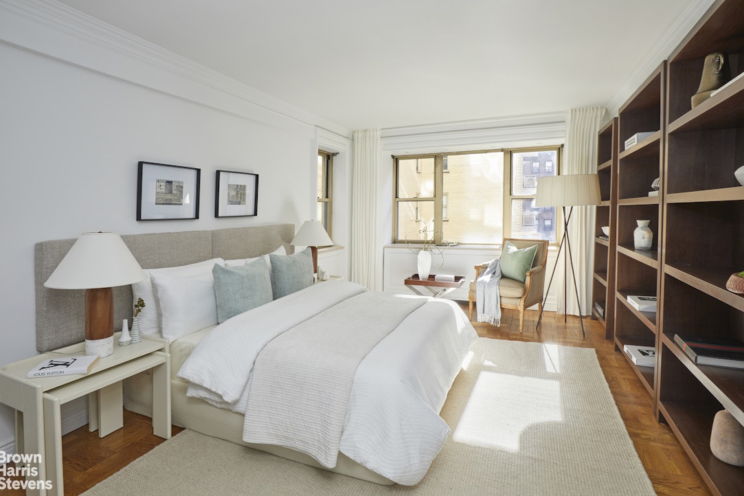 415 East 52nd Street, Unit 6GC Manhattan, NY 10022 - Photo 12 of 15 a bed room with a bed and a chair