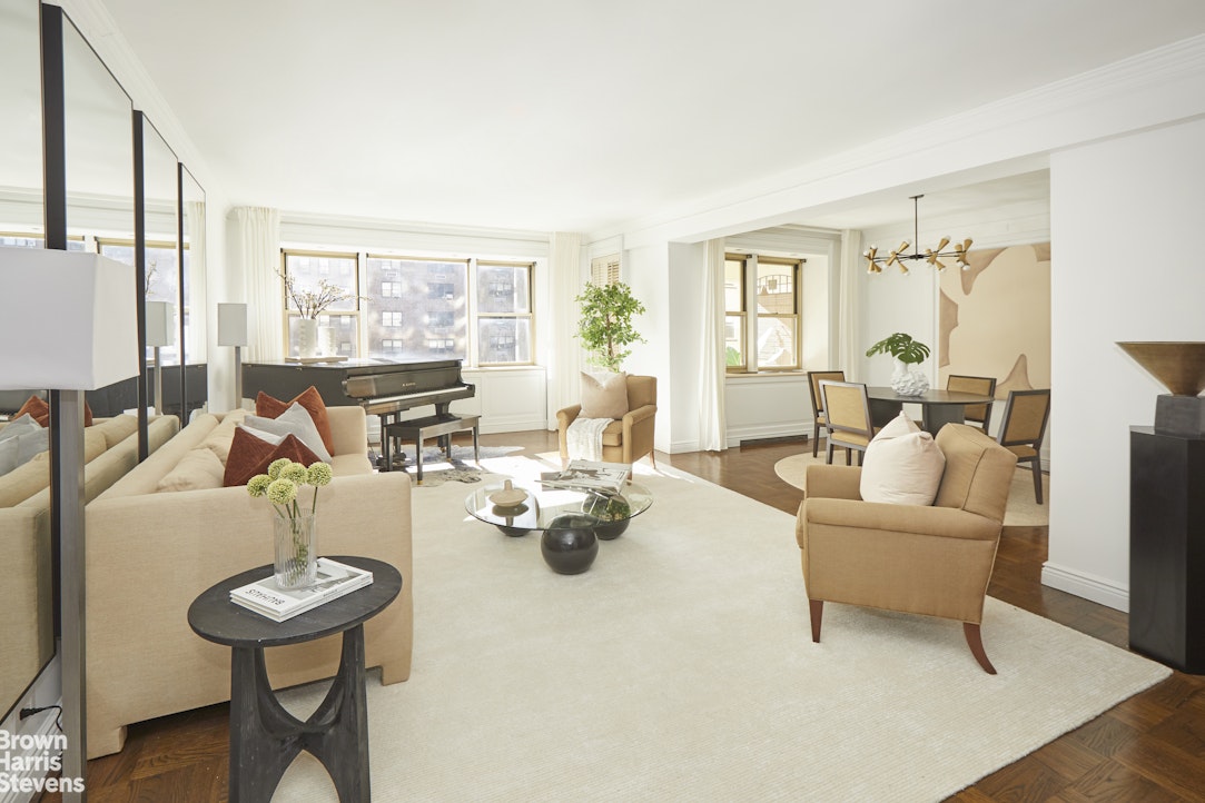 415 East 52nd Street, Unit 6GC Manhattan, NY 10022 - Photo 2 of 15 a living room with furniture and a large window