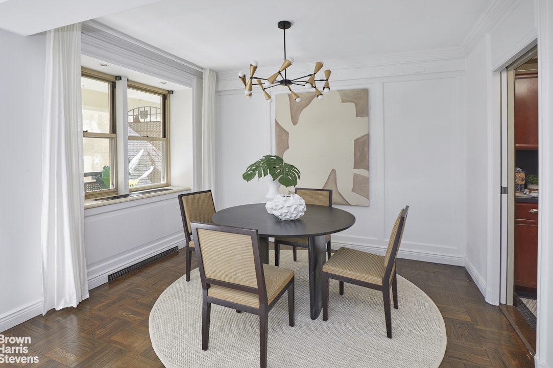 415 East 52nd Street, Unit 6GC Manhattan, NY 10022 - Photo 4 of 15 a view of a dining room with furniture window and wooden floor