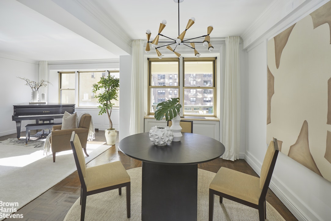 415 East 52nd Street, Unit 6GC Manhattan, NY 10022 - Photo 5 of 15 a view of a dining room with furniture window and outside view
