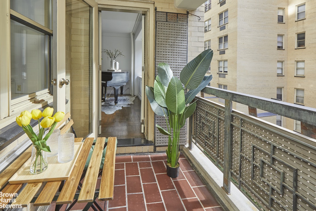 415 East 52nd Street, Unit 6GC Manhattan, NY 10022 - Photo 7 of 15 a floor to ceiling window with wooden floor