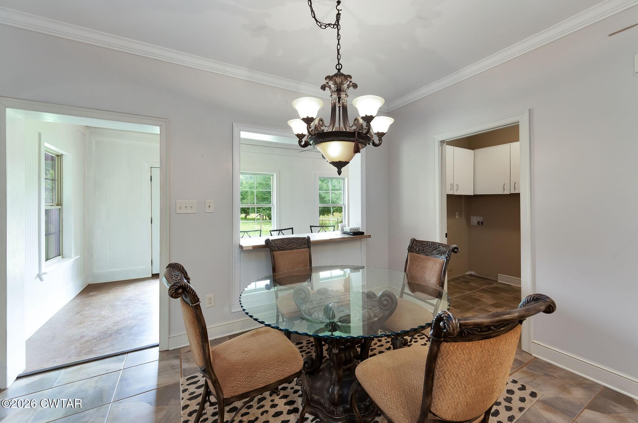 4080 Beech Bluff Road Beech Bluff, TN 38313 - Photo 19 of 41 a dining room with furniture and wooden floor