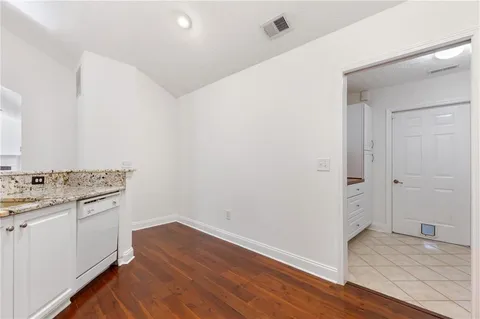 a view of a kitchen with wooden floor