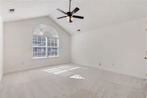 a view of a big room with carpet