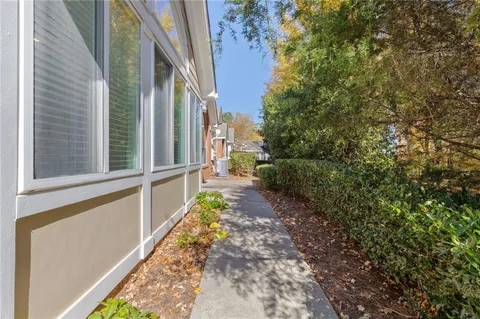 a view of a pathway that has a back yard