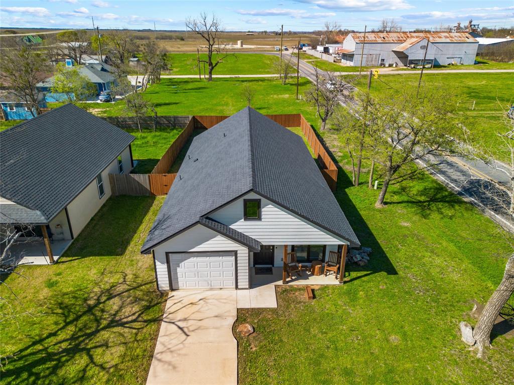 300 West Main Street Itasca, TX 76055 - Photo 2 of 31 a view of a house with a yard