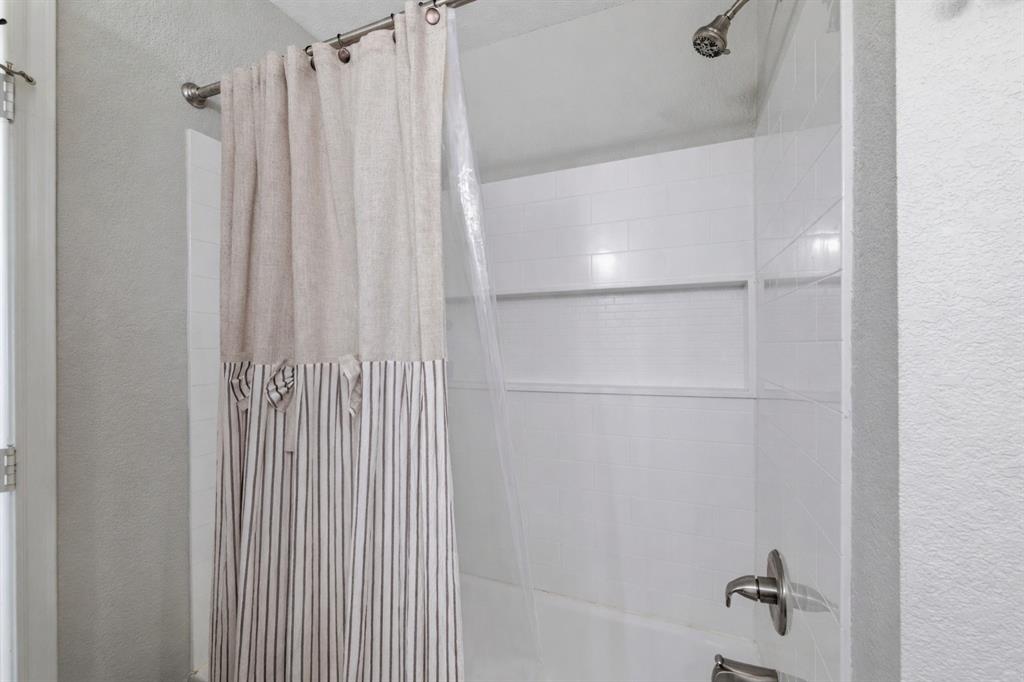 300 West Main Street Itasca, TX 76055 - Photo 23 of 31 a bathroom with a shower