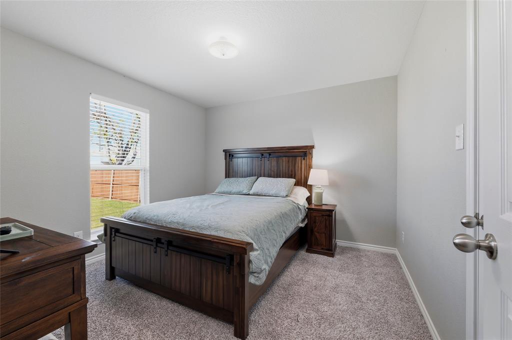 300 West Main Street Itasca, TX 76055 - Photo 25 of 31 a bedroom with a bed and a window