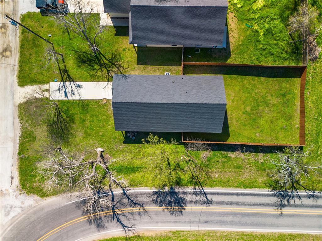 300 West Main Street Itasca, TX 76055 - Photo 29 of 31 a aerial view of a house with garden space and street view