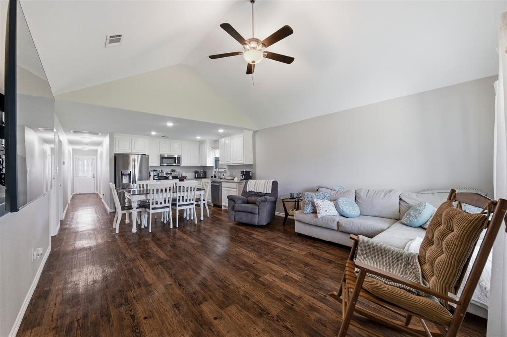 300 West Main Street Itasca, TX 76055 - Photo 5 of 31 a living room with furniture and wooden floor