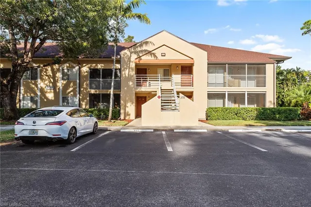 a view of a car parked in front of a building