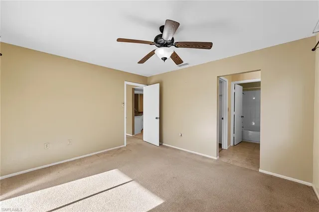 a bathroom with a toilet and a bathtub