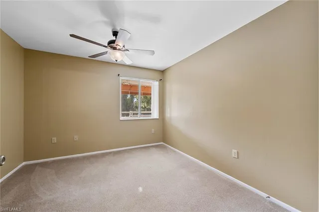 a bathroom with a granite countertop sink a toilet a mirror and shower
