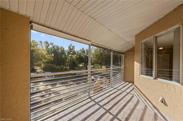 a view of a balcony with wooden floor and outdoor space
