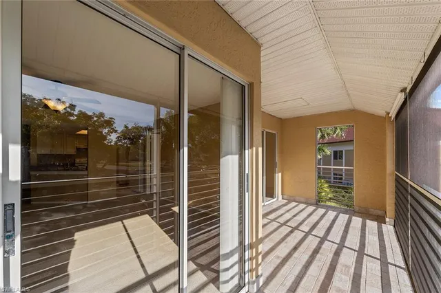 an aerial view of a residential houses with outdoor space and city view
