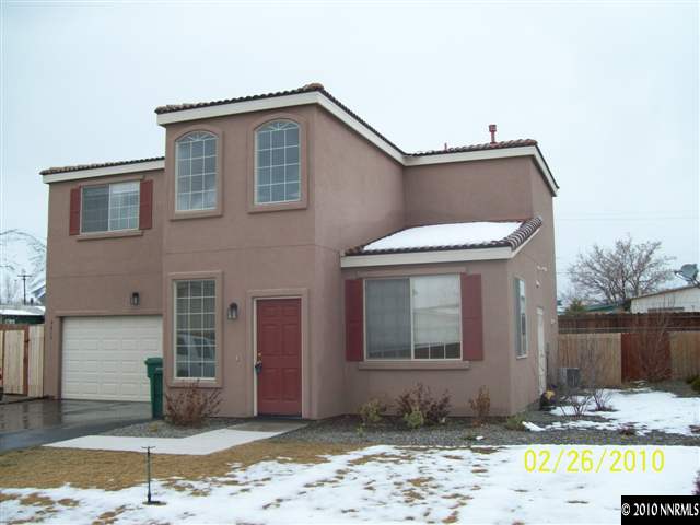 9815 Meadowstar Drive Reno, NV 89506 - Photo 1 of 9 a front view of a house