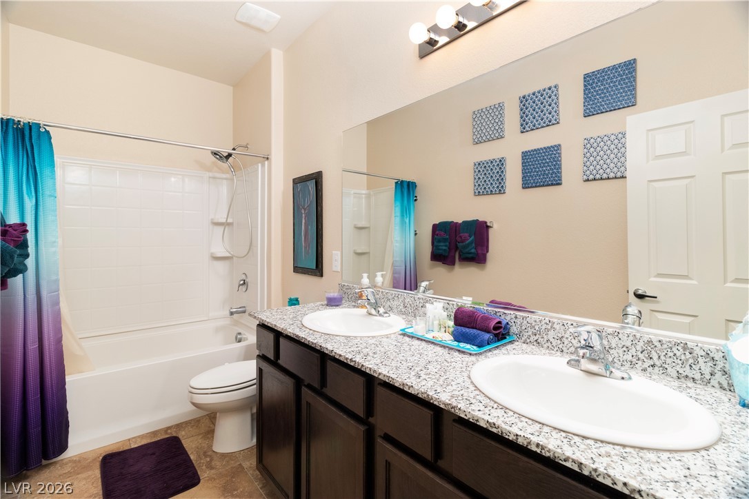 2079 Port Royal Drive Laughlin, NV 89029 - Photo 38 of 86 Full Hall bathroom featuring shower / bathtub combination with curtain and double vanity located in the hall with the Second and Third Bedrooms